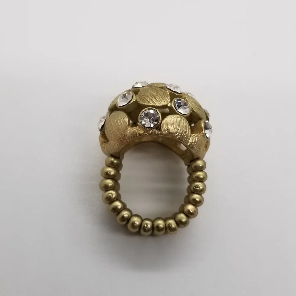 brushed gold tone dome stretch ring with crystal accents